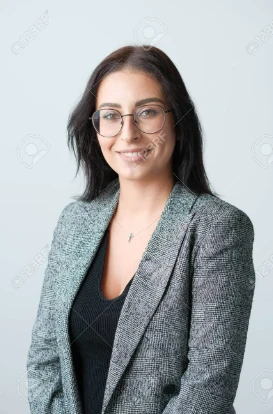 Image of a smiling woman in a blazer with glasses and black hair. Credit: www.123rf.com